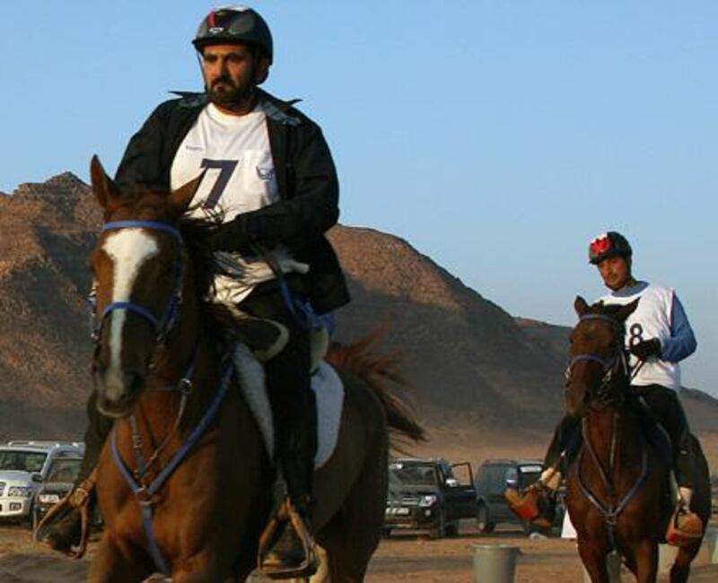 Dubai ruler Sheikh Mohammed bin Rashed al-Maktoum (L), who is also Emirati vice president and prime minister, competes in a horse endurance race in the Jordanian desert of Wadi Rum on November 14, 2008. AFP PHOTO/AWAD AWAD *** Local Caption ***  707226-01-08.jpg