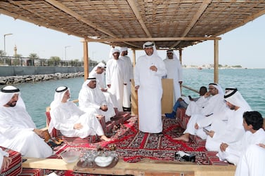 Abdullah Al Suwaidi gives a guided tour of the Al Suwaidi pearl farm to Dr Thani bin Ahmed Al Zeyoudi, Minister of Climate Change and Environment, in Al Rams, Ras Al Khaimah. Chris Whiteoak / The National