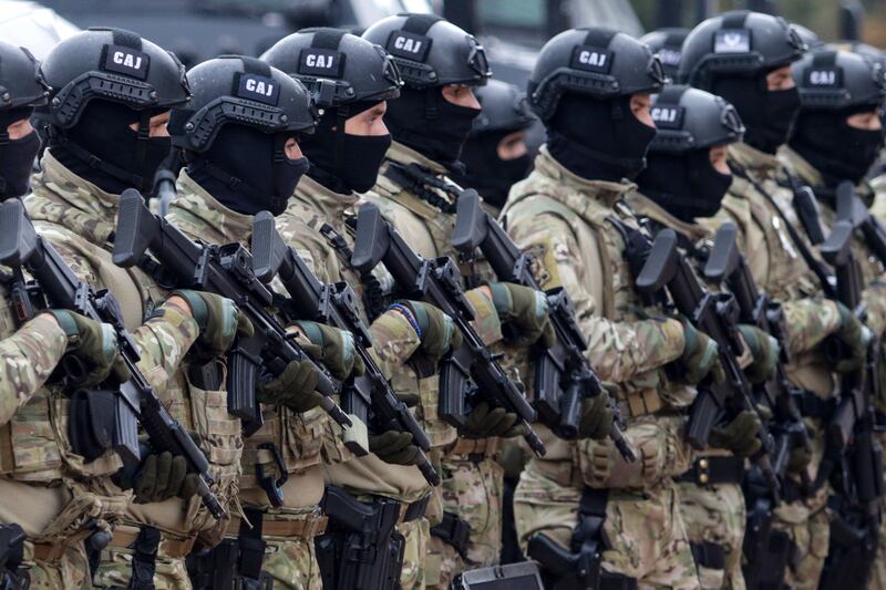 Members of the police forces of Bosnia's Serb-run region stand in formation during exercises on Jahorina Mountain, Bosnia and Herzegovina. AP