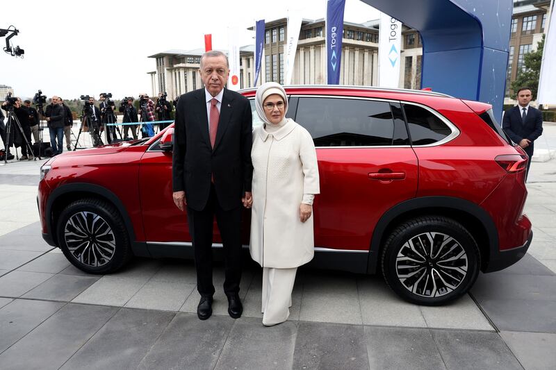Turkey's President Recep Tayyip Erdogan and his wife Emine receive a Togg T10X, the country's first domestically-produced electric car, in Ankara. All photos: AFP
