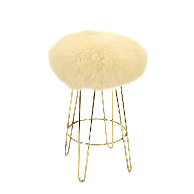 At the other end of the spectrum lies the subtle buttermilk yellow, a good choice for the bedroom. Seen here, the Georgie Baa stool from Lime Lace