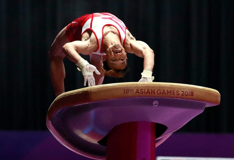 Indonesia's Agus Prayoko performs on the vault. Dita Alangkara / AP Photo