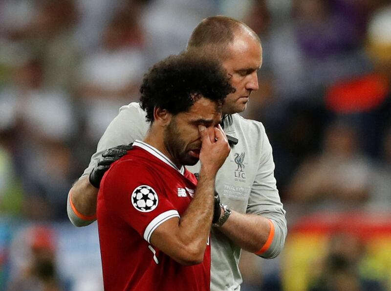 Soccer Football - Champions League Final - Real Madrid v Liverpool - NSC Olympic Stadium, Kiev, Ukraine - May 26, 2018   Liverpool's Mohamed Salah looks dejected as he is substituted off due to injury   REUTERS/Andrew Boyers