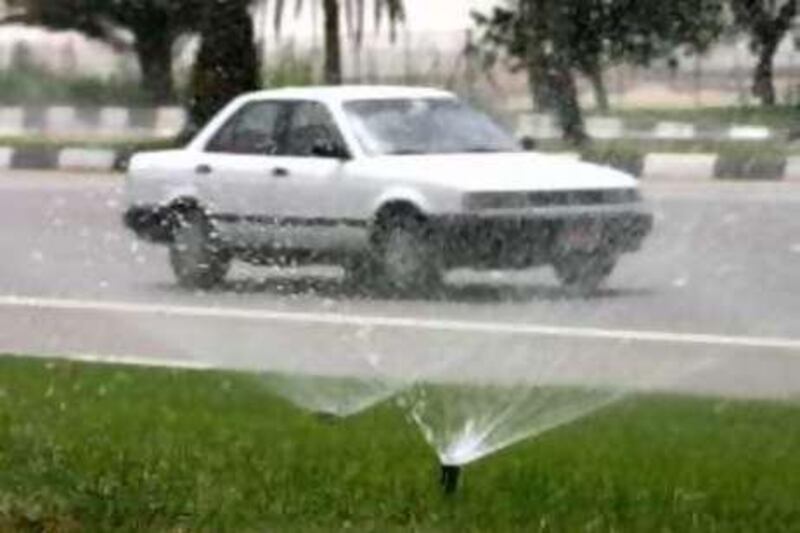 ABU DHABI. 17th June 2008. A sprinkler system on the roadside near Abu Dhabi airport. Stephen Lock  /  The National.  *** Local Caption ***  SL-sprinkler-012.jpgSL-sprinkler-012.jpg