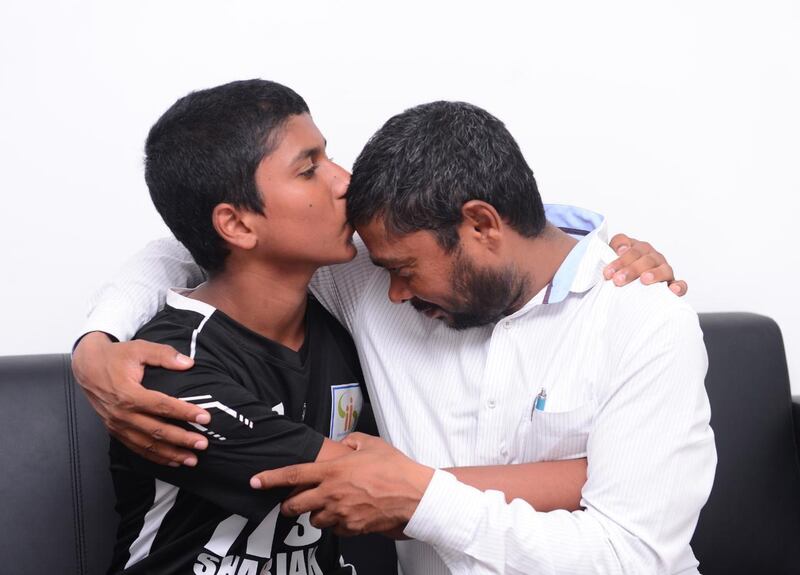 Mohammed Pervez, 15, is reunited with his father, Mohammad Aftab Alam after going missing for 15 days. Sharjah Police photo