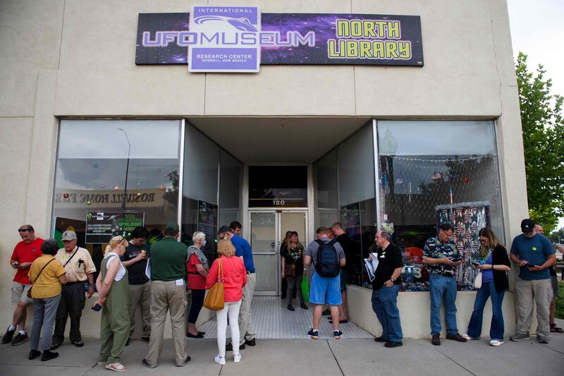 People wait to listen to a panel of UFO experts at the International UFO Museum and Research Centre during the UFO Festival in Roswell, New Mexico. AFP
