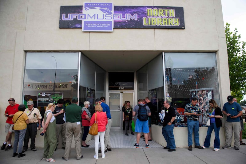 People wait to listen to a panel of UFO experts at the International UFO Museum and Research Centre during the UFO Festival in Roswell, New Mexico. AFP