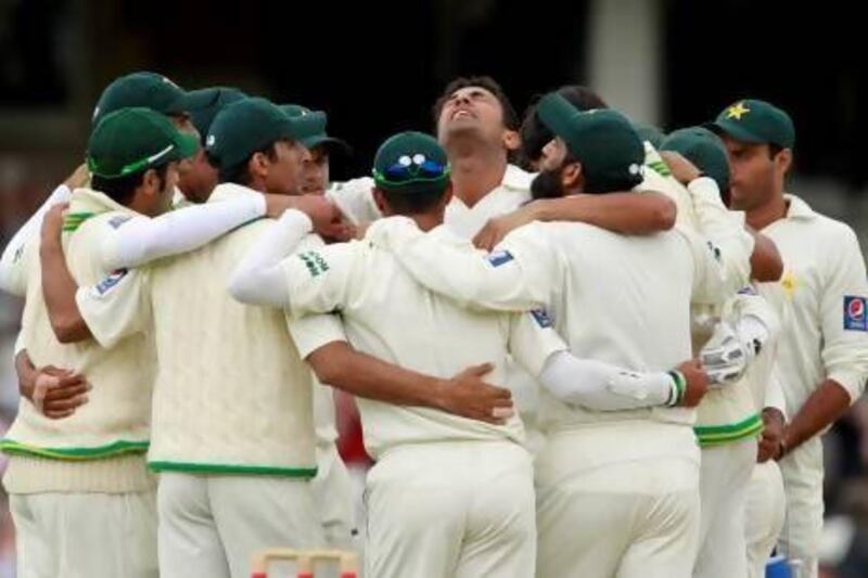 On his debut test match, Pakistan's Wahab Riaz, centre top, celebrates after taking his fifth wicket of the day, the wicket of England's Stuart Broad lbw, during the first day of the third cricket test match between England and Pakistan at The Oval in London on August 18, 2010. Pakistan would go on to win the match.