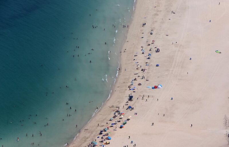 The beach at Jumeirah, which is among numerous coastal sights in Dubai. By 2020, the city is expected to welcome 20 million tourists a year, rising to 25 million throughout Expo 2020. Pawan Singh / The National