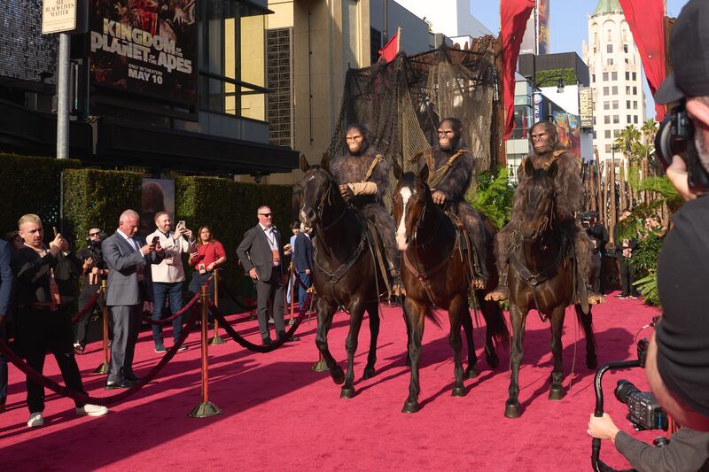 People in ape costumes on horseback at the Kingdom of the Planet of the Apes premiere, at TCL Chinese Theatre in Los Angeles. EPA