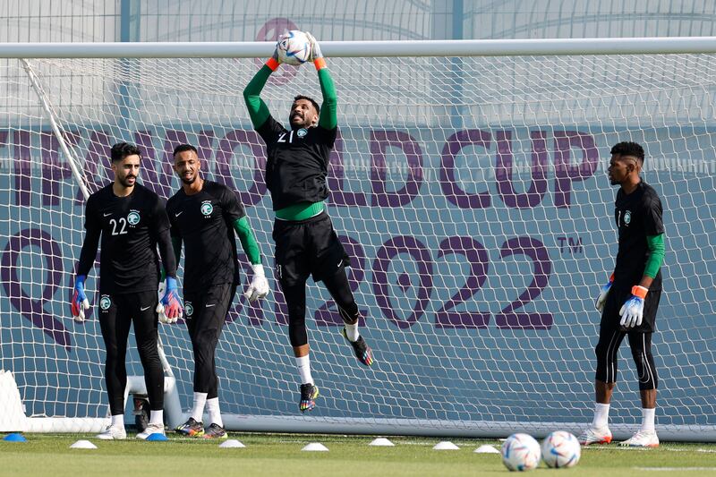 Saudi Arabia's Mohammed Al Owais catches the ball as the squad's goalkeepers take part in a training session as they prepare for their opening game against Argentina in the 2022 World Cup at the Sealine Training Site, south of Doha, Qatar, on November 21, 2022. AFP