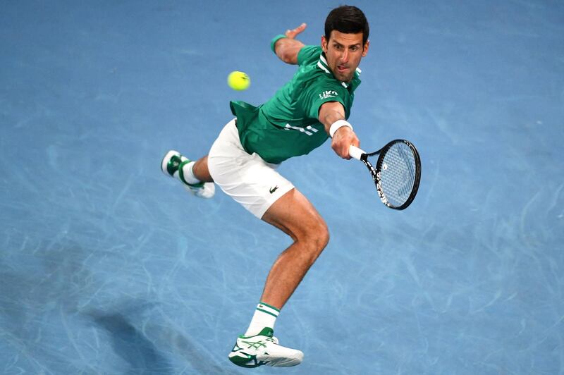 Serbia's Novak Djokovic hits a return against France's Jeremy Chardy during their men's singles match on day one of the Australian Open tennis tournament in Melbourne on February 8, 2021. (Photo by William WEST / AFP) / -- IMAGE RESTRICTED TO EDITORIAL USE - STRICTLY NO COMMERCIAL USE --