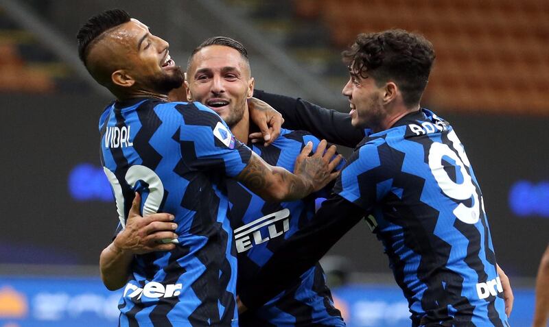 Inter Milan's Danilo D'Ambrosio, centre, celebrates with team-mates after scoring the winner in their 4-3 victory against Fiorentina at the San Siro on Saturday, September 26. EPA
