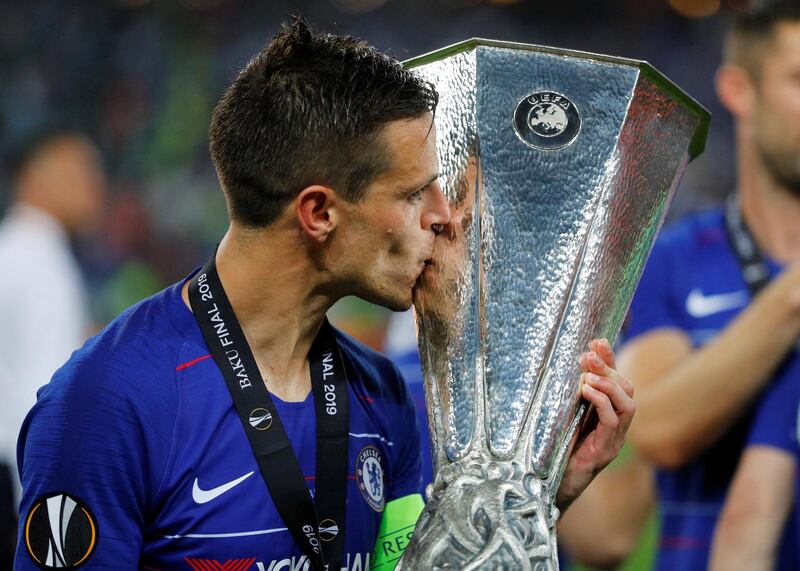 Chelsea's Cesar Azpilicueta celebrates winning the Europa League with the trophy. REUTERS