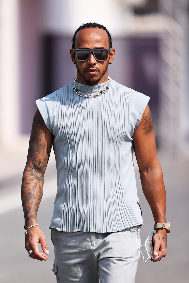 Lewis Hamilton, in a grey sleeveless top and trousers by A-Cold-Wall, in the paddock ahead of the Qatar Grand Prix at Losail International Circuit on November 18, 2021. Getty Images