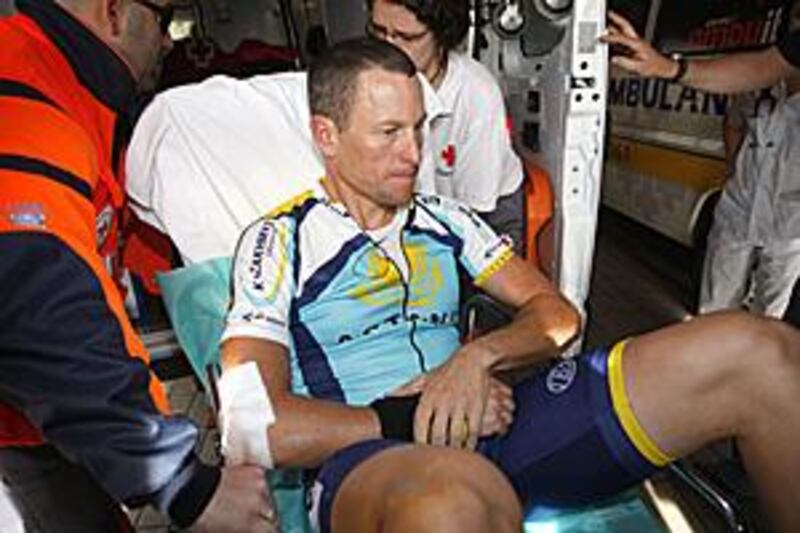 Lance Armstrong arrives at the Hospital Clinico in Valladolid, Spain after crashing in stage one of the Vuelta a Castilla y Leon yesterday.