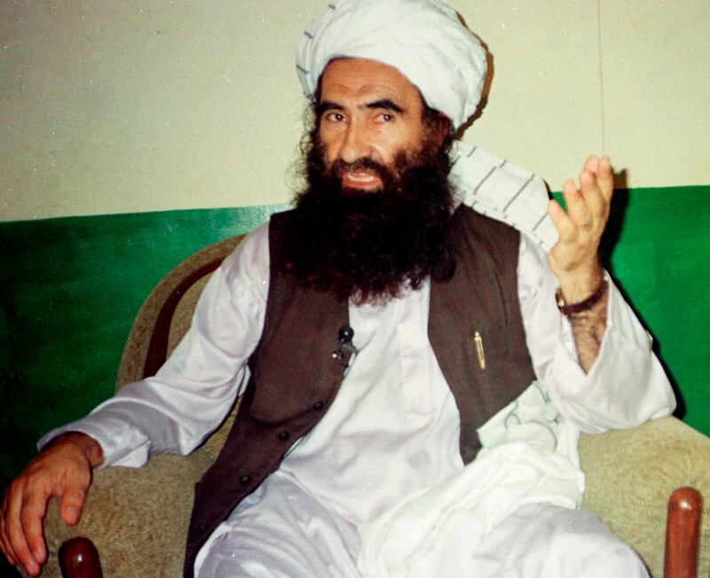 FILE- In this Aug. 22, 1998, file photo, Jalaluddin Haqqani, founder of the militant group the Haqqani network, speaks during an interview in Miram Shah, Pakistan. Taliban say the Afghan Haqqani network founder, Jalaluddin Haqqani, an ex- U.S. ally turned fierce enemy, has died. (AP Photo/Mohammed Riaz, File)