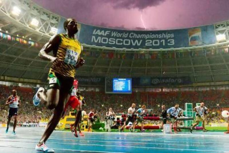 Lightning strikes in the sky after Jamaica's Usain Bolt wins the 100 metres final.