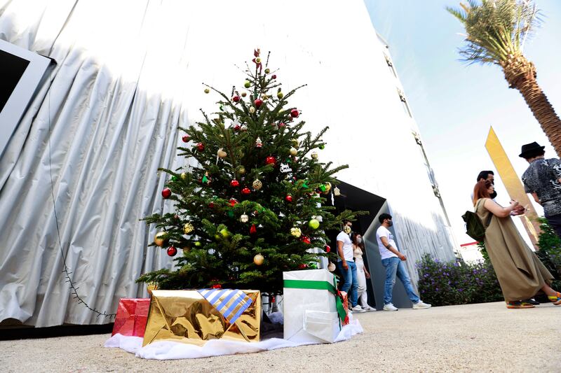 Enticing presents under a Christmas tree outside the Swiss pavilion.