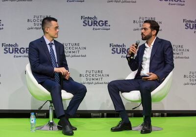 Changpeng Zhao, chief executive of Binance, left and Gabriel Abed, Barbados's ambassador to the UAE, during a panel discussion at Gitex Global in Dubai in October. Photo: Leslie Pableo / The National