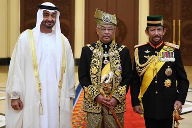 Sheikh Mohamed bin Zayed, Crown Prince of Abu Dhabi and Deputy Supreme Commander of the Armed Forces, with Malaysia's King Abdullah Ri’ayatuddin Al-Mustafa Billah Shah and Brunei's Sultan Hassanal Bolkiah (R) after his royal coronation at the National Palace in Kuala Lumpur. AFP