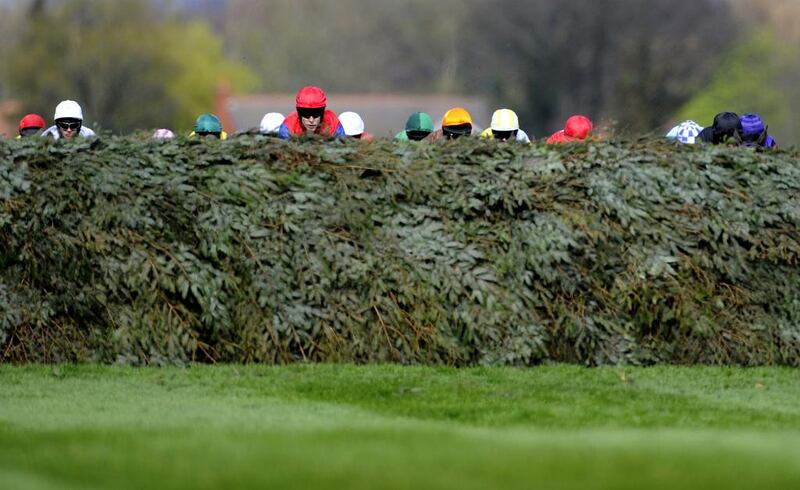 Runners and riders approach the Chair in The Crabbie's Supporting Everton In The Community Topham Steeple Chase at Aintree racecourse on Friday in Liverpool, England. Alan Crowhurst / Getty Images / April 4, 2014 