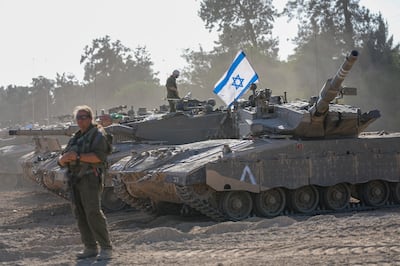 Israeli soldiers and tanks at a staging area near the border with the Gaza Strip in southern Israel. AP 