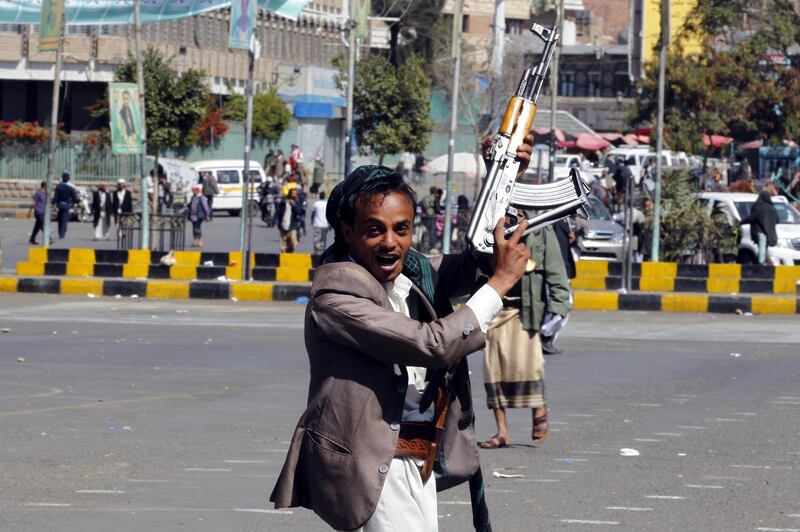 epa06365138 A Houthi follower holds up his gun at a square a day after fighting broke out between Houthi rebels and the forces loyal to Yemen’s ex-president Ali Abdullah Saleh, in Sana’a, Yemen, 03 December 2017. Yemen's rebel alliance continued to come apart as fighting took place on 02 December between the Houthis and their onetime allies, the forces loyal to ex-President Ali Abdullah Saleh. At least 40 people were killed, including civilians, and dozens were wounded in the Yemeni capital Sanaa.  EPA/YAHYA ARHAB