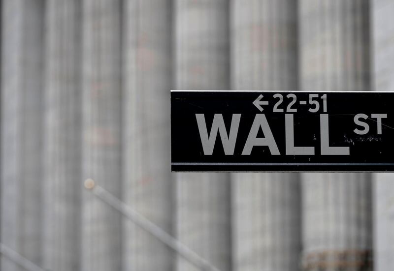 (FILES) In this file photo a Wall Street sign near the New York Stock Exchange (NYSE) is seen on May 8, 2020 in New York City. US stocks continued last week's rally as trading opened June 8, 2020, buoyed by ebbing civil unrest and state measures to reopen their economies following the coronavirus shutdowns.Shortly after the opening bell, the Dow Jones Industrial Average was up 0.5 percent to 27,257.08.The tech-rich Nasdaq advanced 0.1 to 9,822.85, while the broad-based S&P 500 gained 0.2 percent to 3,201.61.
 / AFP / Johannes EISELE
