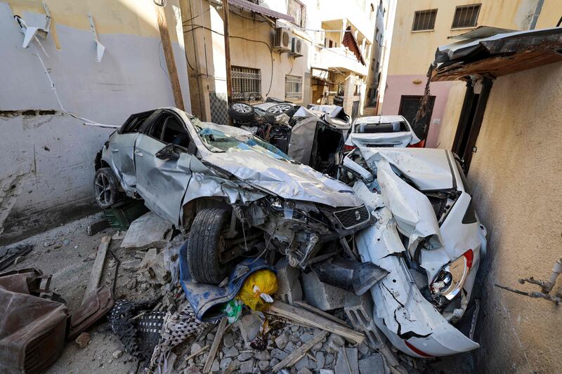 Wrecked cars in an alleyway in the occupied West Bank city. AFP