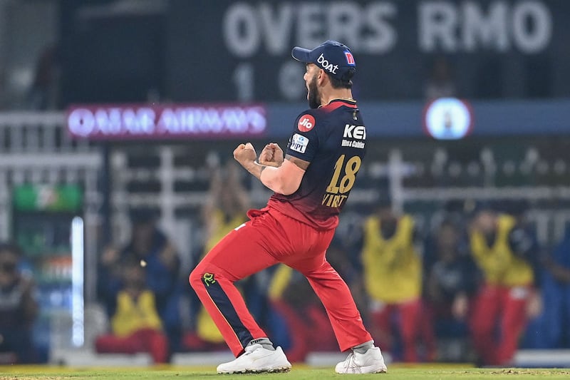 Royal Challengers Bangalore's Virat Kohli celebrates after the dismissal of Lucknow Super Giants' Marcus Stoinis. AFP