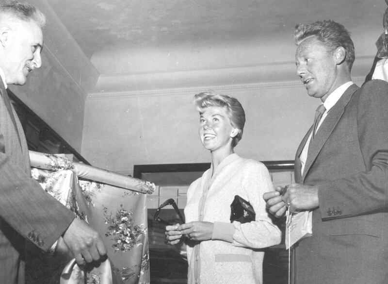 3rd May 1955:  American film actress and singer Doris Day, shopping with Van Johnson in the Italian Riviera resort of San Remo.  (Photo by Keystone/Getty Images)