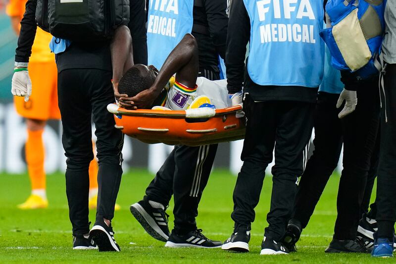 Senegal's Cheikhou Kouyate is taken from the field on a stretche. AP 