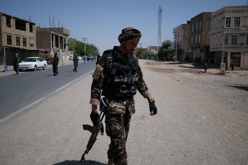 Afghan government forces and militia allies work together on the front line.