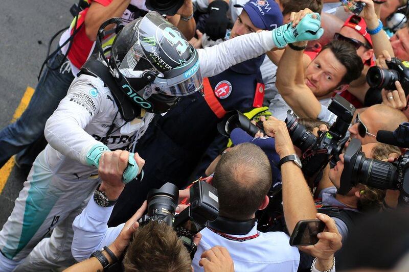 Nico Rosberg celebrates with teammates after winning the MOnaco Grand Prix on Sunday. Alexander Klein / AFP / May 25, 2014 