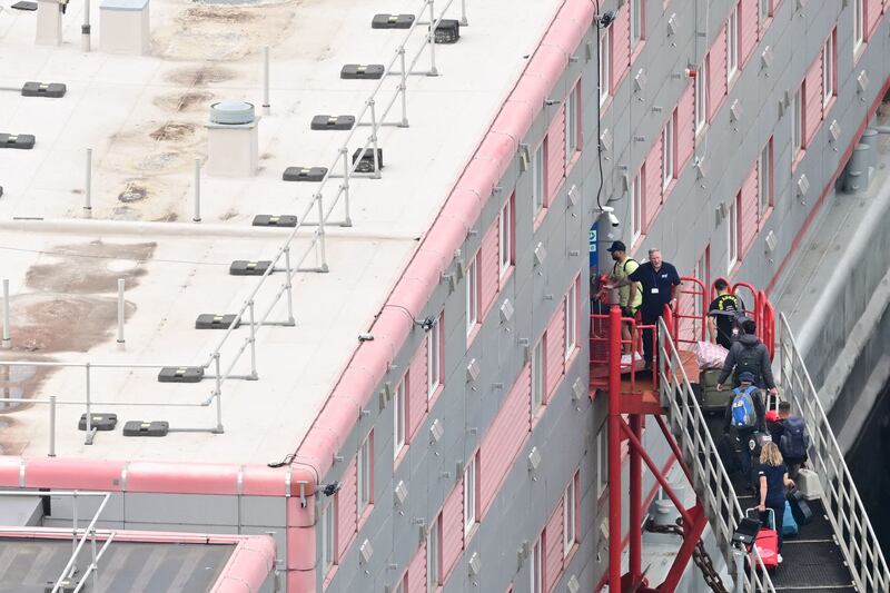 Migrants are being hosted on the Bibby Stockholm, which is being used as an accommodation barge in Dorset. AFP