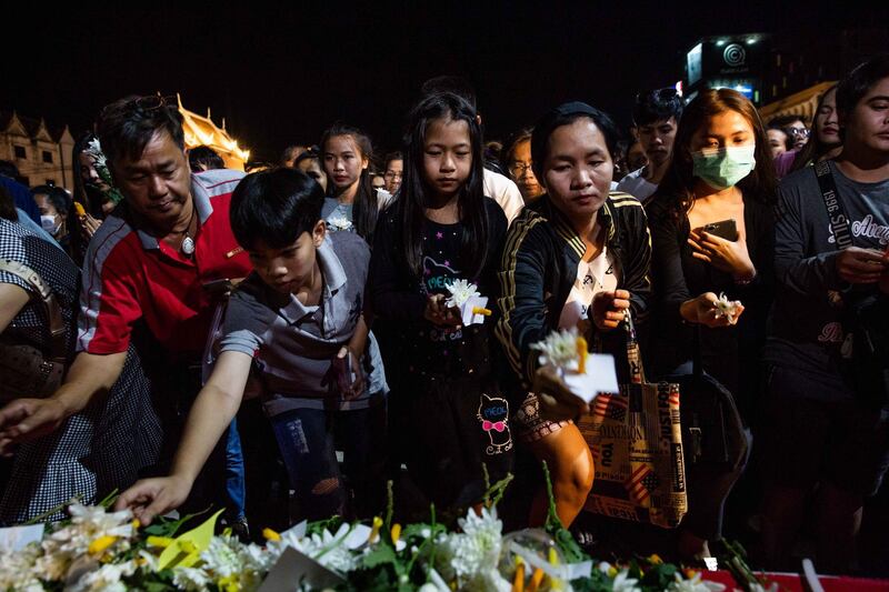 Thai mourners attend a candlelight vigil for the victims of the Terminal 21 Mall shooting on February 9, 2020 in KORAT, Thailand. Getty Images