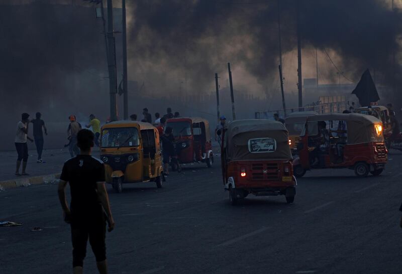 Young tuk-tuk drivers wait to carry wounded protests to transfer them to hospitals during anti-government protests in Baghdad, Iraq. REUTERS