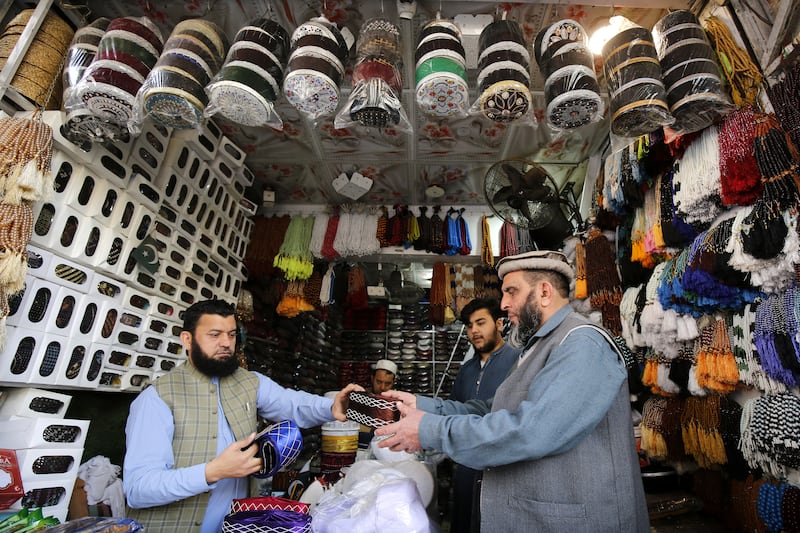 People buy prayer caps in Peshawar, Pakistan. EPA