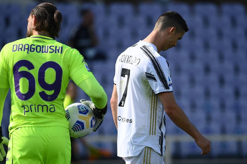 Juventus' Portuguese forward Cristiano Ronaldo reacts after missing a goal opportunity against Fiorentina's Polish goalkeeper Bartlomiej Dragowski. AFP