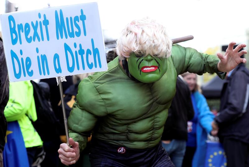 A demonstrator dressed as Hulk holds a placard as he attends a "Stop Brexit" protest. Reuters