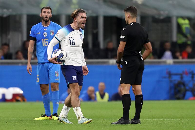 England's Jack Grealish reacts to referee Jesus Gil Manzano, and then gets booked. Getty
