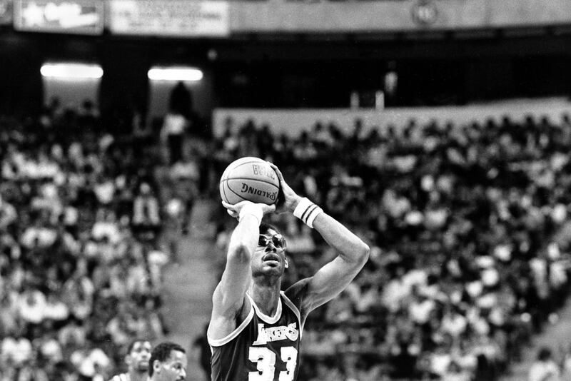 Los Angeles Lakers center Kareem Abdul-Jabbar (33) shoots one of his baskets on his way to breaking Wilt Chamberlain's NBA scoring record during action against the Utah Jazz in Las Vegas, Nev., Thursday, April 5, 1984.  Abdul-Jabbar needed 21 points and scored 22 points to give him a regular season record of 31,421 points.  (AP Photo/Lennox McLendon)