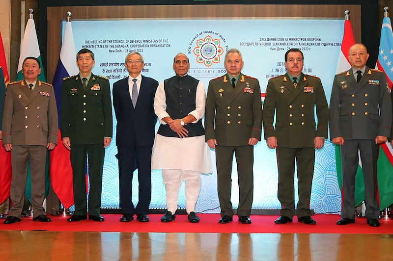 This handout photograph taken on April 28, 2023 and released by the Indian Ministry of Defence shows (L to R) Kyrgyzstan's Defence Minister Bekbolotov Baktybek Asankalievich, Chinese Defence Minister Li Shangfu, Shanghai Cooperation Organisation (SCO) Secretary-General Zhang Ming, Indian Defence Minister Rajnath Singh, Russian Defence Minister Sergei Shoigu, Tajikistan Defence Minister Sherali Mirzo and Uzbekistan Defense Minister Bakhodir Kurbanov posing for group picture during the SCO meet in New Delhi.  AFP