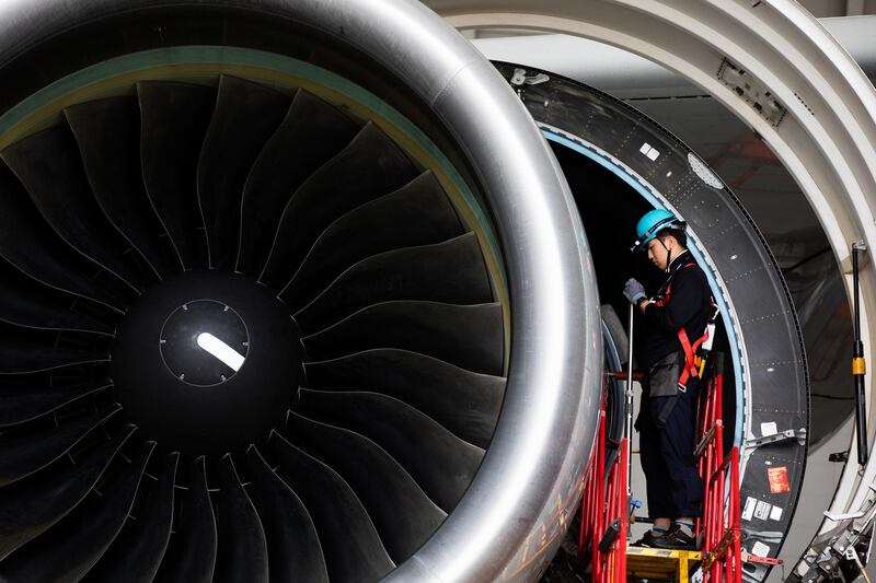 An employee works on an Airbus A380-800 passenger aircraft operated by Korean Air Line Co. in a hangar at Incheon International Airport in Incheon, South Korea, on Wednesday, Aug. 7, 2019. Korean Air Lines is scheduled to release its earnings figures on Aug. 14. Photographer: SeongJoon Cho/Bloomberg