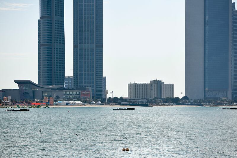 Fireworks for New Year celebrations are set up in the water by the Abu Dhabi Corniche. Khushnum Bhandari / The National