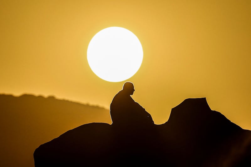 A pilgrim prays at dawn on Mount Arafat during the Hajj pilgrimage on Saturday. Temperatures in Makkah climbed to 51.8°C this year. AFP
