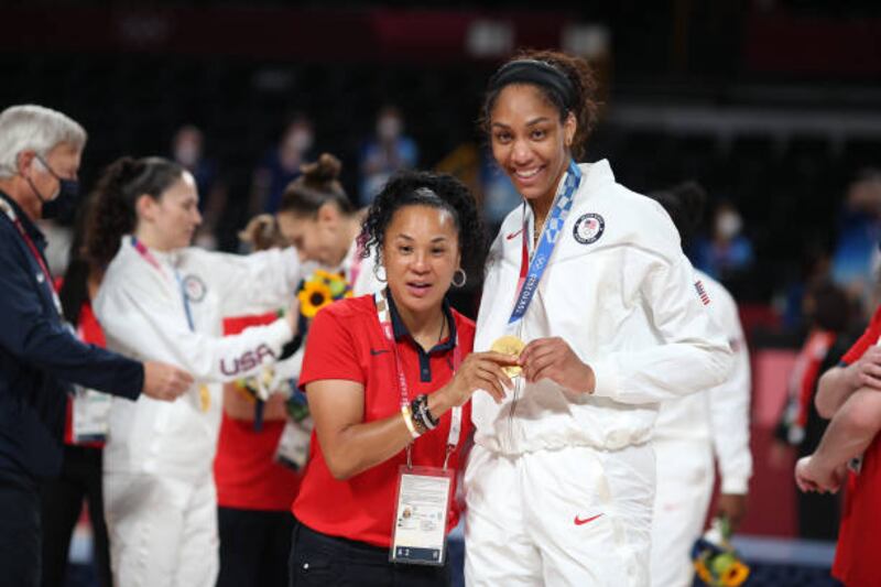 Head coach Dawn Staley of the United States with A'ja Wilson with her gold medal.