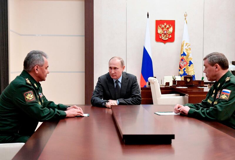 Russian President Vladimir Putin, center, Russian Defense Minister Sergey Shoigu, left, and Chief of the General Staff of the Russian Armed Forces Valery Gerasimov during a meeting in Moscow, Russia, Friday, April 20, 2018. (Alexei Nikolsky, Kremlin Pool Photo via AP)