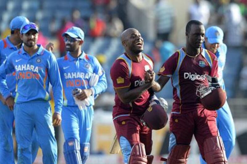 Tino Best, left, and Kemar Roach put on a crucial 10-run stand as West Indies beat India.